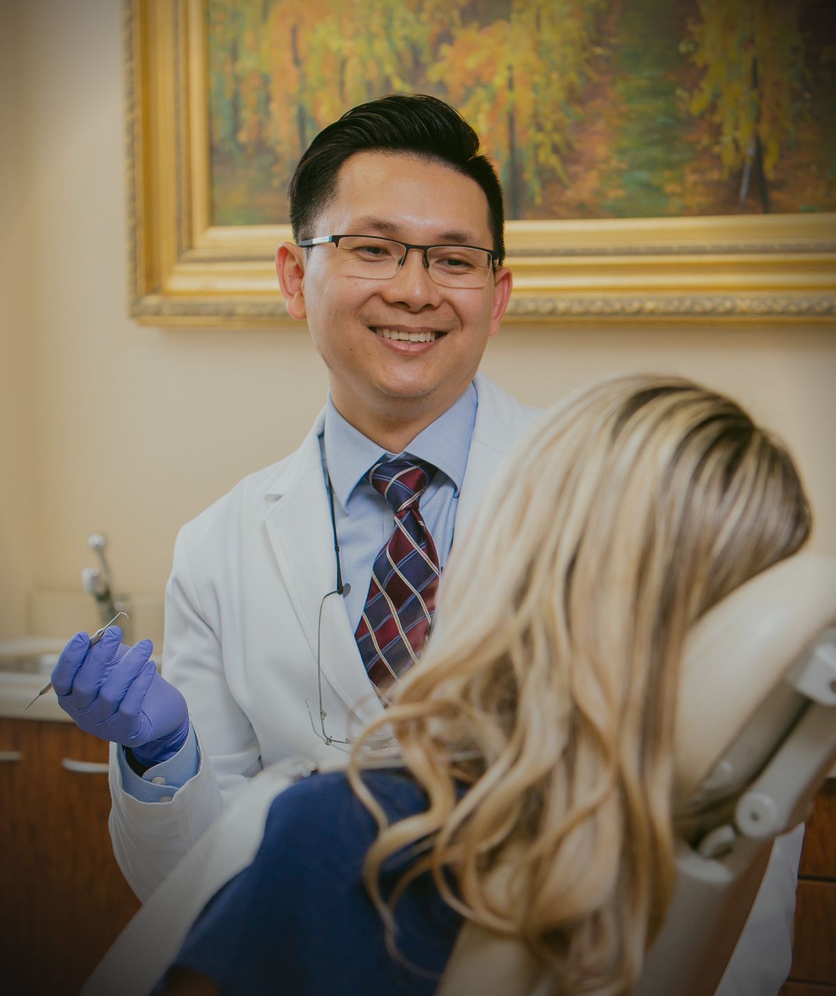 Newport beach dentist - Dr. Chau with patient